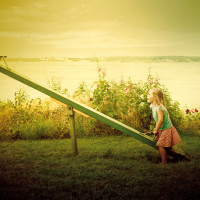 Girl playing on a seesaw